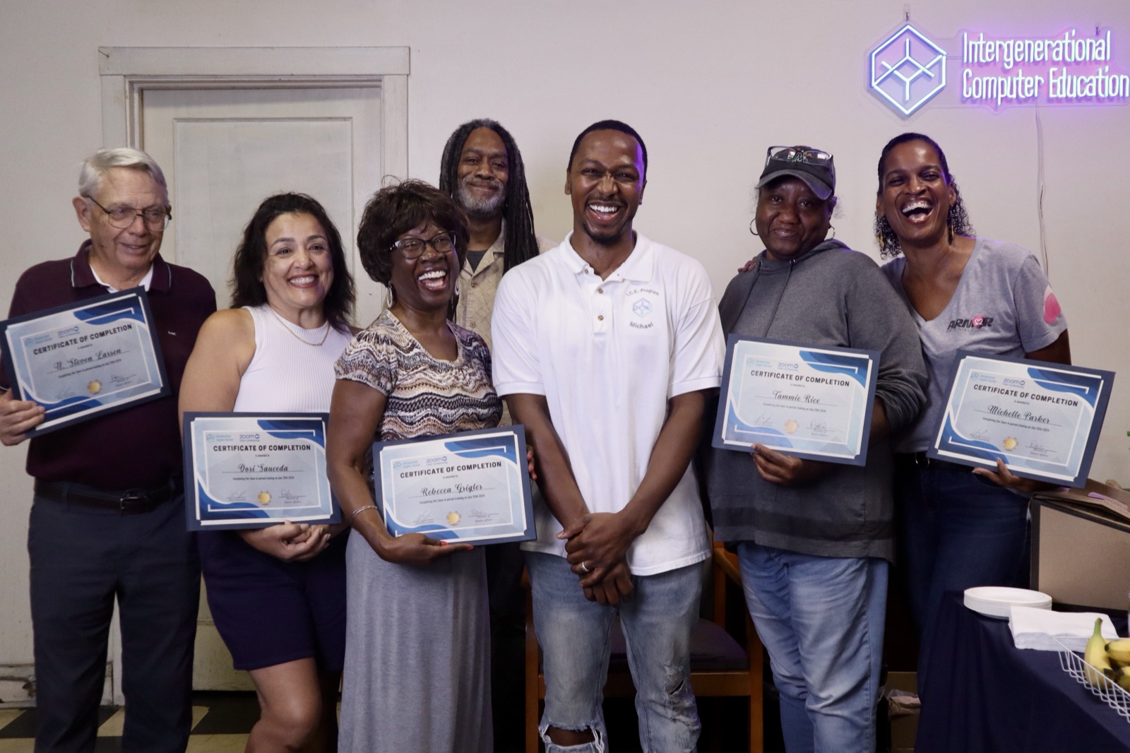 Senior Saturdays graduates holding their certificates of completion with IgCE founder Michael Bass