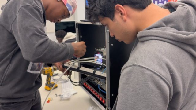 CyberSecure Teens students working with computers and network equipment